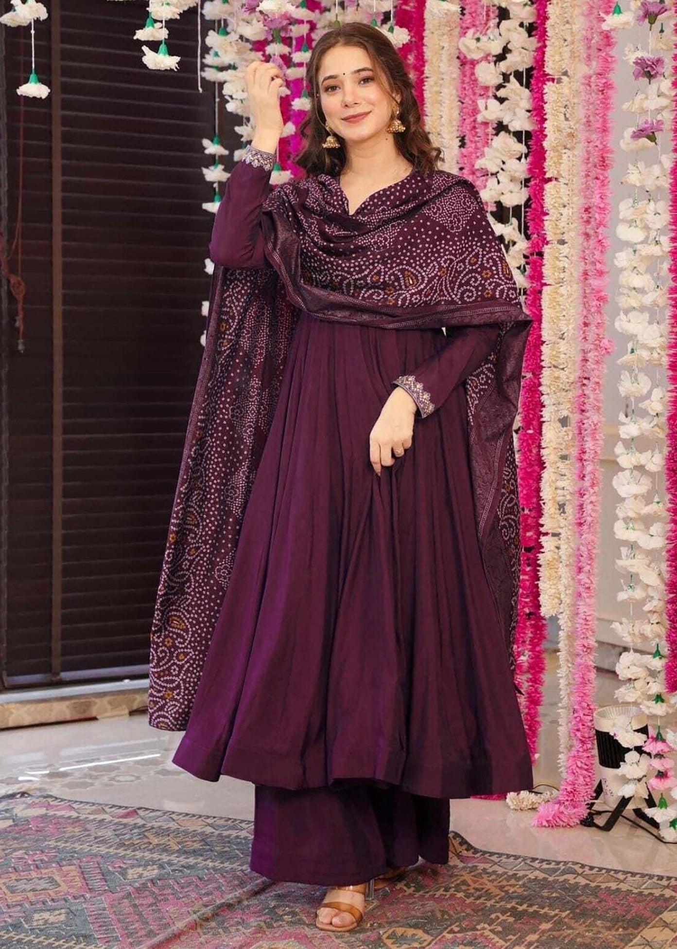 Woman wearing a pink Art Silk woven kurta with matching green straight pants and a green woven Art Silk dupatta featuring traditional motifs and decorative border.
