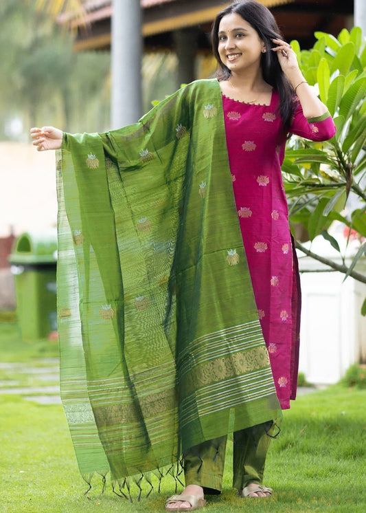 Woman wearing a pink Art Silk woven kurta with matching green straight pants and a green woven Art Silk dupatta featuring traditional motifs and decorative border.